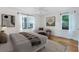 Serene bedroom featuring hardwood floors, neutral decor, and large windows that fill the space with natural light at 2240 Cheshire Bridge Rd # 205, Atlanta, GA 30324