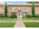 Charming building with stone facade, well-maintained landscaping, and clear address signage, creating an inviting curb appeal at 2240 Cheshire Bridge Rd # 205, Atlanta, GA 30324