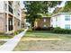 Exterior view of complex with beautiful landscaping and walkway at 2240 Cheshire Bridge Rd # 205, Atlanta, GA 30324