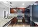 Modern kitchen with stainless steel appliances, including a gas range and refrigerator, and granite countertops with lots of light at 2240 Cheshire Bridge Rd # 205, Atlanta, GA 30324