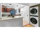 Well-equipped kitchen with stainless steel appliances, granite countertops, and convenient in-unit laundry at 2240 Cheshire Bridge Rd # 205, Atlanta, GA 30324