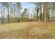 Spacious backyard with mature trees and privacy fence at 4036 Evelyn Dr, Powder Springs, GA 30127