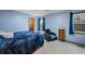 Cozy bedroom with blue walls, plush carpeting, and ample natural light at 4036 Evelyn Dr, Powder Springs, GA 30127