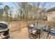 Deck with dining set, grill, and backyard view at 4036 Evelyn Dr, Powder Springs, GA 30127