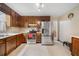 Kitchen boasts stainless steel appliances and ample wood cabinetry at 4036 Evelyn Dr, Powder Springs, GA 30127