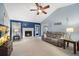 Living room with a fireplace, vaulted ceiling and neutral carpeting at 4036 Evelyn Dr, Powder Springs, GA 30127