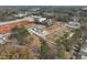 An aerial view displays a neighborhood of modern townhomes in a wooded setting at 417 Carrera Ln, Acworth, GA 30102