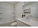 Bathroom with bathtub, toilet, white vanity, and large mirror at 417 Carrera Ln, Acworth, GA 30102