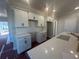 Bright kitchen with white cabinets, stylish hardware, and modern countertops at 417 Carrera Ln, Acworth, GA 30102