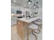 Kitchen island with quartz countertop and light wood cabinets at 417 Carrera Ln, Acworth, GA 30102