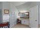 Elegant bathroom with granite double vanity and large mirror at 437 Cherry Tree Ln, Marietta, GA 30066