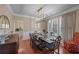 Formal dining room with hardwood floors, chandelier, and large windows at 437 Cherry Tree Ln, Marietta, GA 30066