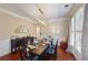 Formal dining room with hardwood floors, chandelier, and large windows at 437 Cherry Tree Ln, Marietta, GA 30066