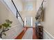 Two-story foyer with hardwood floors, a staircase, and decorative console table at 437 Cherry Tree Ln, Marietta, GA 30066