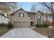 Brick two-story house with a two-car garage and landscaped yard at 437 Cherry Tree Ln, Marietta, GA 30066