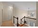 Upstairs hallway with carpeted floor, neutral walls, and doors to bedrooms at 437 Cherry Tree Ln, Marietta, GA 30066