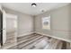 Simple bedroom with wood-look floors and a window at 540 Hamilton E Holmes Nw Dr, Atlanta, GA 30318