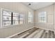 Cozy bedroom with wood-look floors and multiple windows at 540 Hamilton E Holmes Nw Dr, Atlanta, GA 30318