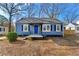 Charming blue house with a white trim and a small front porch at 540 Hamilton E Holmes Nw Dr, Atlanta, GA 30318