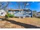 Side view of a blue house with a yard at 540 Hamilton E Holmes Nw Dr, Atlanta, GA 30318