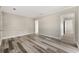 Open living room with wood-look floors and access to other rooms at 540 Hamilton E Holmes Nw Dr, Atlanta, GA 30318