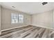 Spacious living room with neutral walls and wood-look floors at 540 Hamilton E Holmes Nw Dr, Atlanta, GA 30318