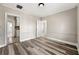 Living room with wood-look floors and access to kitchen at 540 Hamilton E Holmes Nw Dr, Atlanta, GA 30318