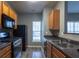 Functional kitchen with wood cabinets, stainless steel sink, and ample counter space at 2566 Walden Lake Dr, Decatur, GA 30035