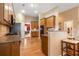 Spacious kitchen with granite countertops, ample cabinetry, and hardwood floors at 3210 Sand Hill Ct, Cumming, GA 30041