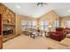 Relaxing living room featuring stone fireplace and comfortable seating at 3210 Sand Hill Ct, Cumming, GA 30041