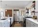 Modern kitchen with stainless steel appliances and white cabinetry at 3515 King Springs Se Rd, Smyrna, GA 30080