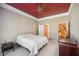 Spacious bedroom with a ceiling fan and en-suite bathroom access at 630 Birnamwood Dr, Suwanee, GA 30024