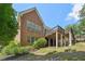 Brick home with large deck and landscaped yard at 630 Birnamwood Dr, Suwanee, GA 30024
