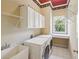 Laundry room with washer, dryer, and extra storage at 630 Birnamwood Dr, Suwanee, GA 30024