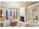 Comfortable living room with built-in shelving and fireplace at 630 Birnamwood Dr, Suwanee, GA 30024