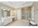 Main bathroom with double vanity, walk in shower and soaking tub at 630 Birnamwood Dr, Suwanee, GA 30024