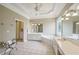 Main bathroom with double vanity, soaking tub and shower at 630 Birnamwood Dr, Suwanee, GA 30024