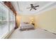 Main bedroom with high ceilings and a ceiling fan at 630 Birnamwood Dr, Suwanee, GA 30024