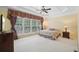 Bright main bedroom with large windows and carpeted floor at 630 Birnamwood Dr, Suwanee, GA 30024