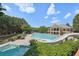 Community pool with water slide and separate kiddie pool at 630 Birnamwood Dr, Suwanee, GA 30024