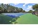 Community tennis courts with blue and green surfaces at 630 Birnamwood Dr, Suwanee, GA 30024