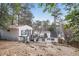 Backyard view showing main house and outbuilding both with upper level decks at 976 Cardova Ne Dr, Atlanta, GA 30324