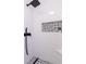 Black matte shower fixtures and patterned tile at 5375 Ashwind Trce, Alpharetta, GA 30005