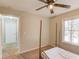 Well-lit bedroom with a window and hallway view at 100 Jessamine Trl, Lawrenceville, GA 30046