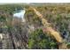 Aerial view of property showcasing wooded area and lake at 1126 Wedgefield Dr, Marietta, GA 30064