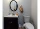Small bathroom with toilet, sink, and vanity at 1126 Wedgefield Dr, Marietta, GA 30064