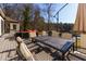 Deck overlooking lake with seating and dining areas at 1126 Wedgefield Dr, Marietta, GA 30064