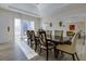 Bright dining room with a large table and chairs, hardwood floors, and access to the backyard at 1126 Wedgefield Dr, Marietta, GA 30064