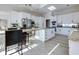 Open concept kitchen with island, granite countertops, and white cabinets at 1126 Wedgefield Dr, Marietta, GA 30064