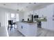 White kitchen with large island, granite countertops, and stainless steel appliances at 1126 Wedgefield Dr, Marietta, GA 30064